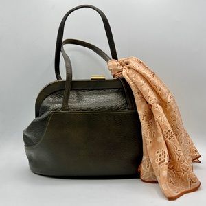 SOLD- Vintage 50s/60s brown leather Saber handbag with brass hardware—good cond.